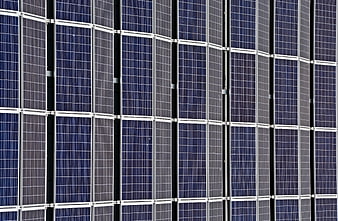 Close-up pattern of blue solar panels and photovoltaic cells