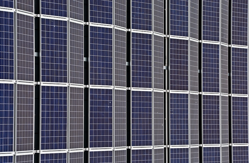 Close-up pattern of blue solar panels and photovoltaic cells