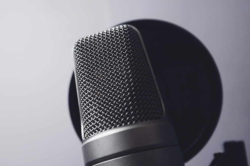 Close-up of professional studio microphone with pop filter