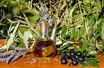 Glass Carafe of Olive Oil with Black Olives and Lavender