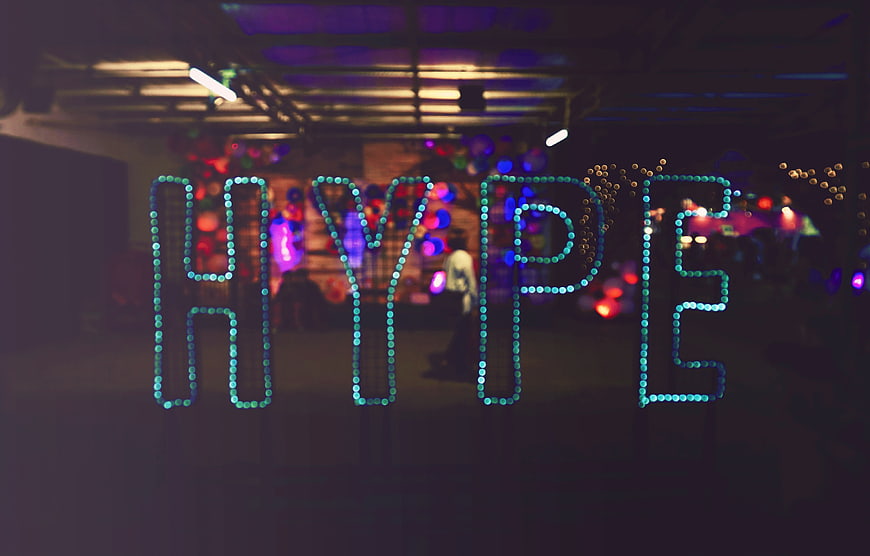 Hype Neon Sign in a Dark Bar with Bokeh Lights