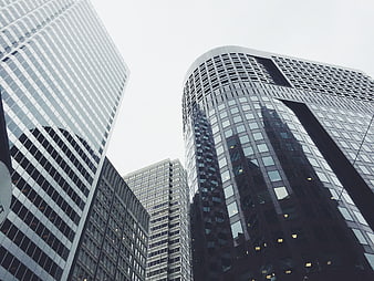 Low angle view of modern glass skyscrapers in urban city