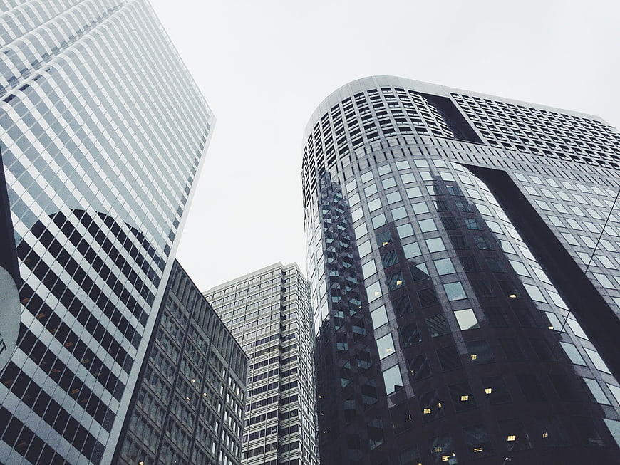 Low angle view of modern glass skyscrapers in urban city