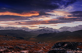 Dramatic Sunset Over Rocky Mountain Valley Landscape