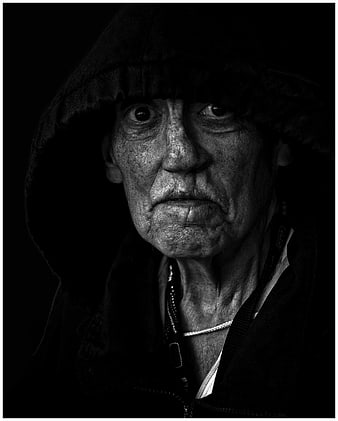 Dramatic Black and White Portrait of Elderly Woman in Hood