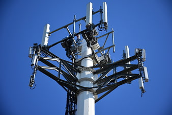 Cellular Tower Antennas Against Clear Blue Sky