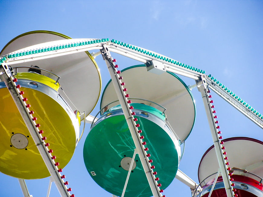 Colorful Ferris Wheel Against Blue Sky