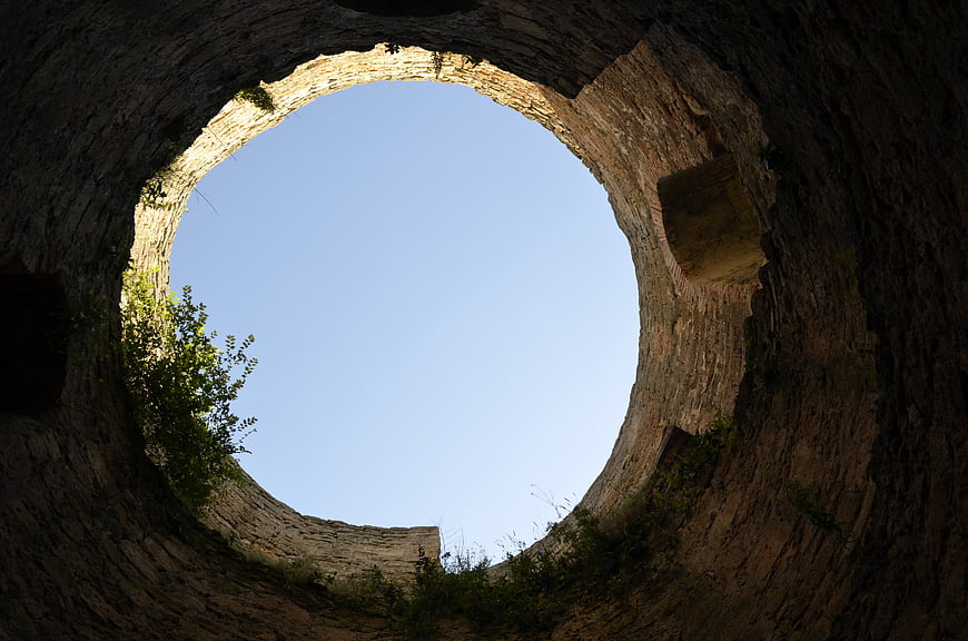 Circular Stone Ruin Tower Interior Looking Up To Blue Sky