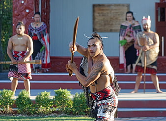 Maori Warrior Performing Traditional Dance With Spear