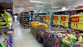 Supermarket Aisle With Promotional Signs And Snack Displays