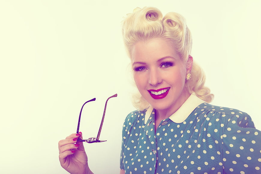 Vintage Pinup Woman with Glasses and Polka Dot Dress