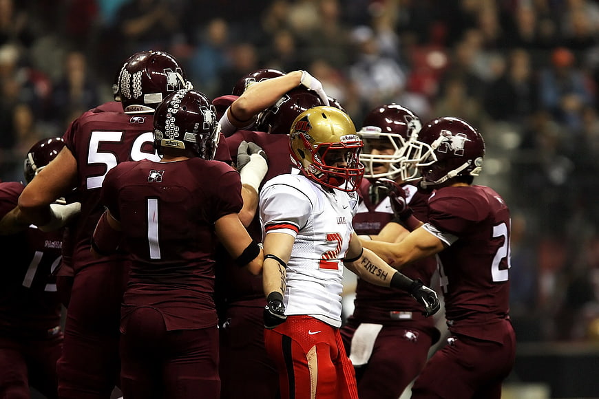 Football players celebrating a touchdown on the field