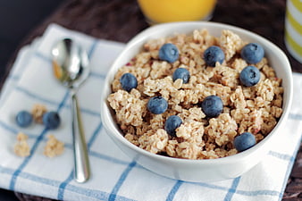 Bowl of Granola with Blueberries and Orange Juice