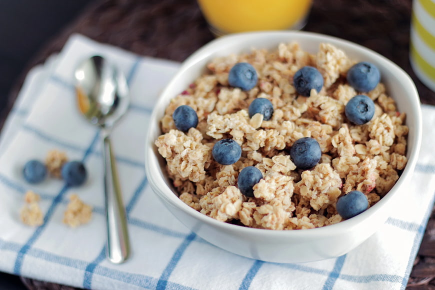 Bowl of Granola with Blueberries and Orange Juice