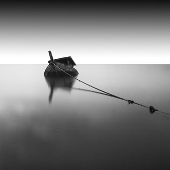 Minimalist Black and White Long Exposure of a Wooden Boat