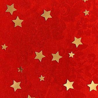 Red textured background with scattered gold star confetti