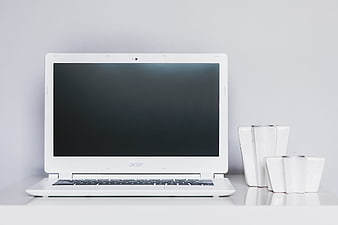 White Acer Laptop on Minimalist Desk with Vases