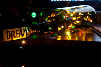 Glass Bottle with Dreams Label and Christmas Lights