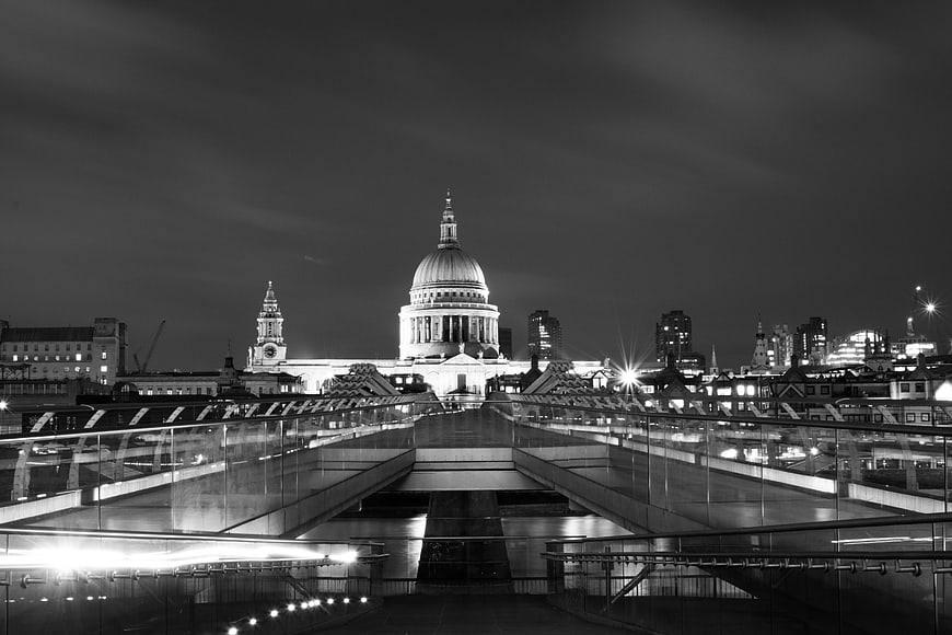 Black and white night view of St Paul's Cathedral and Millennium Bridge