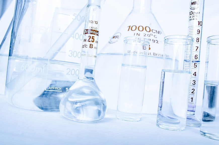 Laboratory glassware with clear liquid in scientific research setting