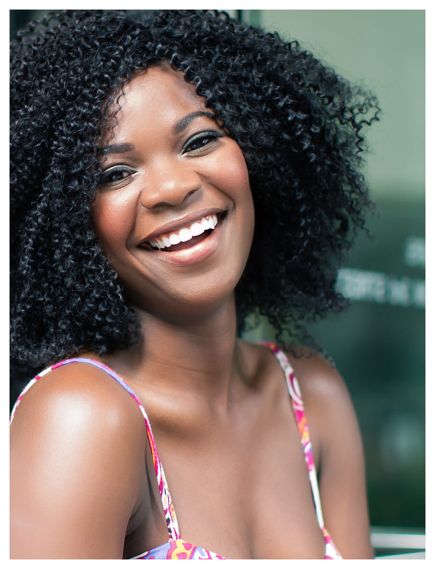 Smiling Black Woman With Curly Hair In Summer Outfit