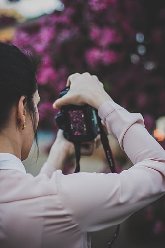 Woman Photographer Taking Photo of Pink Flowers