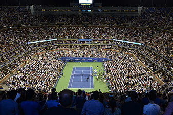 Wide Night View of US Open Tennis Stadium with Large Crowd
