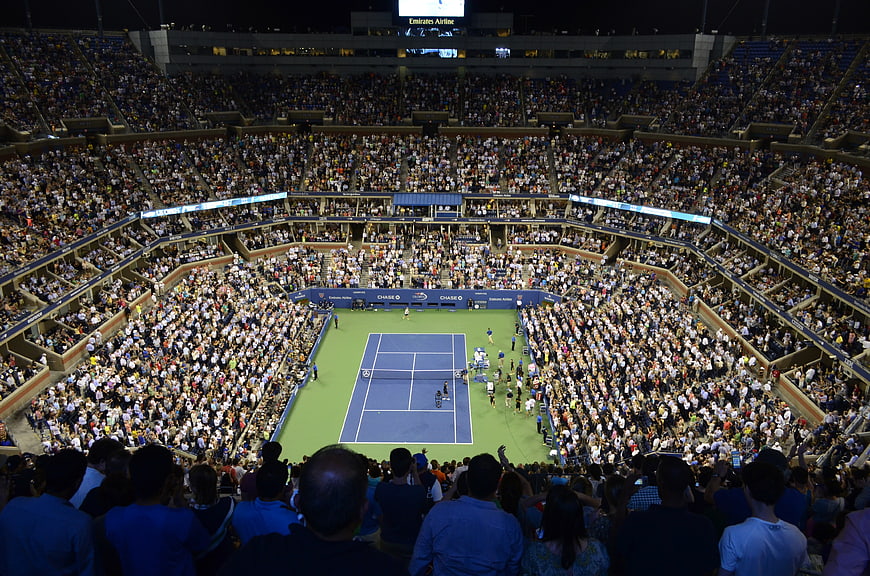 Wide Night View of US Open Tennis Stadium with Large Crowd