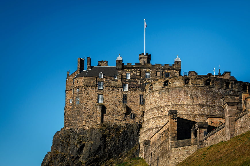 Edinburgh Castle on a Rocky Outcrop Against a Clear Blue Sky