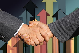 Business Handshake Over Colorful Growth Arrows And Bar Chart Background