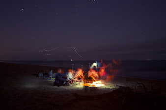 Night Beach Bonfire with Friends Under Starry Sky