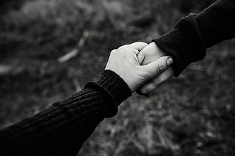 Black and White Close-Up of Couple Holding Hands