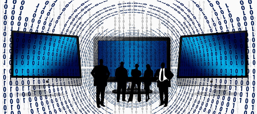 Business team silhouettes in digital data tunnel with monitors