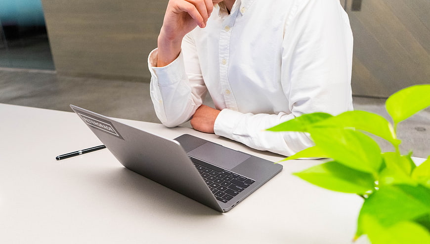 Business person working on laptop in modern office