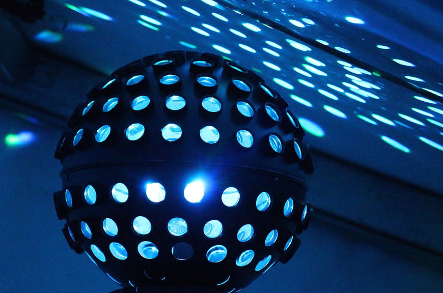 Blue LED disco ball with light reflections on ceiling
