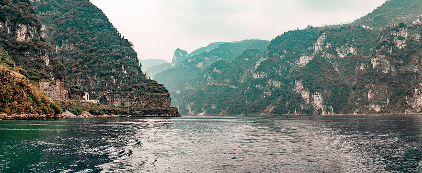 Panoramic View of Majestic River Gorge with Steep Mountains