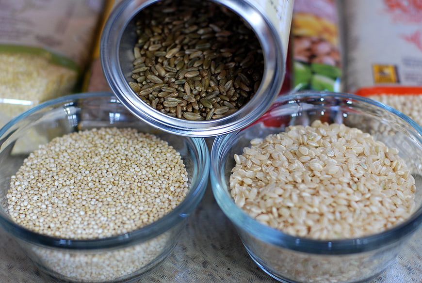 Bowl of Quinoa, Brown Rice, and Spilling Seeds
