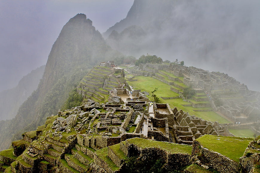 Machu Picchu ruins shrouded in mist and fog