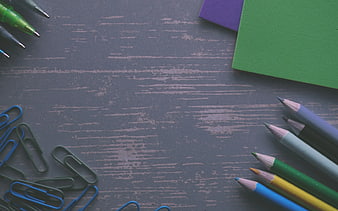 Flat lay of colorful stationery on gray wooden background