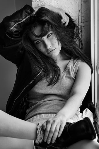 Black and white portrait of woman in leather jacket