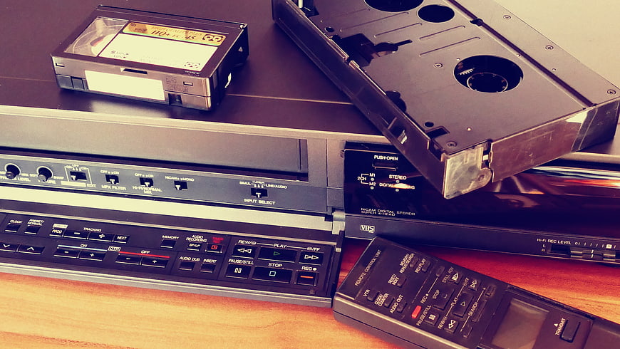 Vintage VCR with VHS Tapes and Remote Control