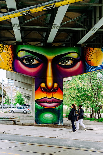 Vibrant Street Art Mural Under Urban Bridge
