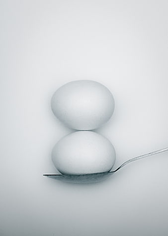 Minimalist White Eggs on Spoon