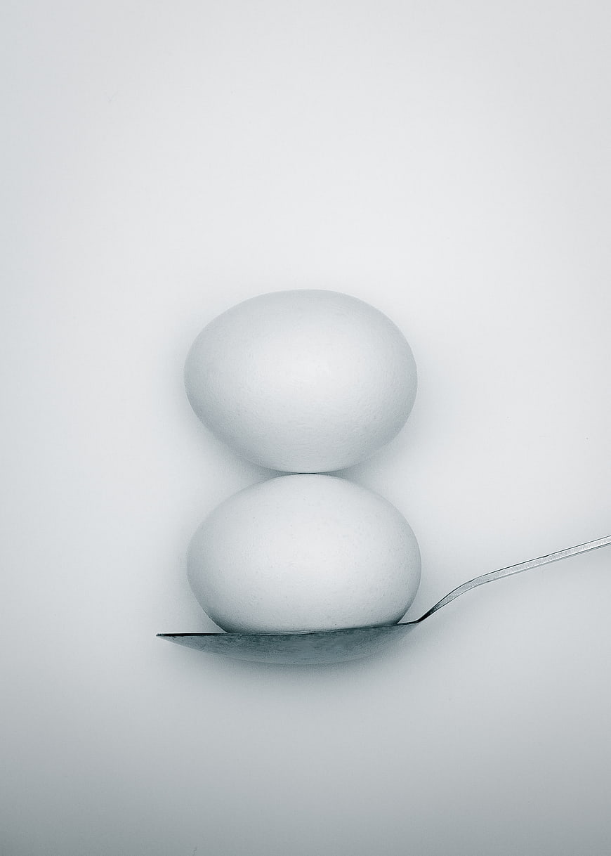 Minimalist White Eggs on Spoon