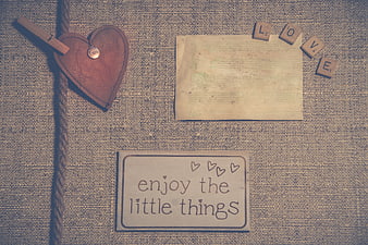 Vintage rustic flat lay with love note and wooden heart
