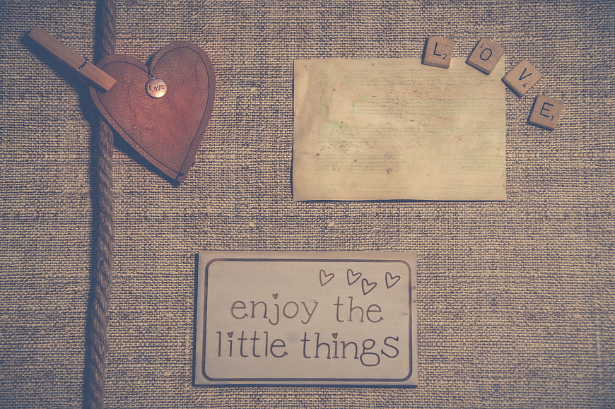 Vintage rustic flat lay with love note and wooden heart