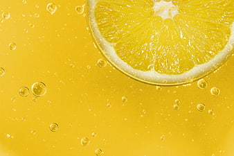 Refreshing Lemon Slice in Sparkling Yellow Citrus Drink