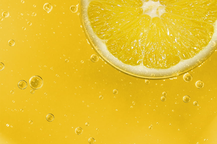 Refreshing Lemon Slice in Sparkling Yellow Citrus Drink