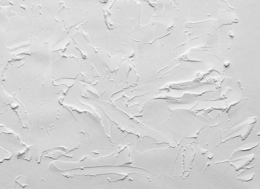 White textured plaster wall background with abstract paint strokes