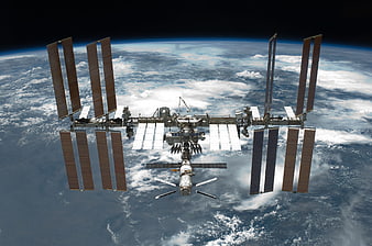 International Space Station Orbiting Earth With Solar Panels